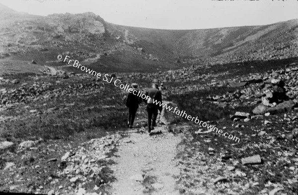 TWO MEN WAKLING ALONG BOREEN